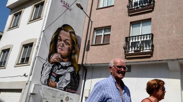They help liven up a town that Hermida says has suffered an “agonising and chronic” crisis sparked by the decline in its once buoyant shipyards. “That pushed people to migrate, to leave, and there are lots of abandoned houses,” the 52-year-old artist said. (Miguel Riopa / AFP) They help liven up a town that Hermida says has suffered an “agonising and chronic” crisis sparked by the decline in its once buoyant shipyards. “That pushed people to migrate, to leave, and there are lots of abandoned houses,” the 52-year-old artist said. (Miguel Riopa / AFP)