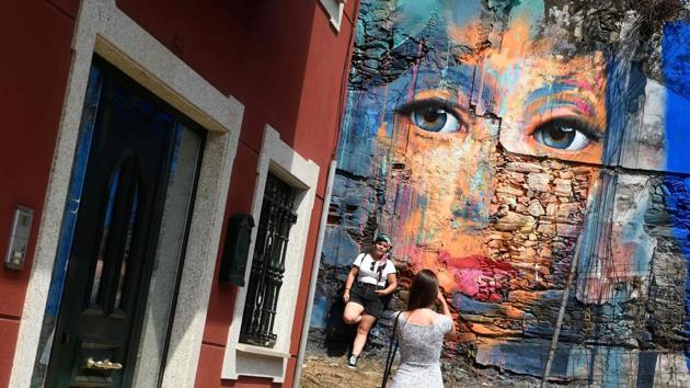 A mural seen during the annual street art festival “Meninas de Canido” set up in 2008 in Ferrol, Spain. Sick of watching his derelict neighbourhood dying a slow death, Spanish artist Eduardo Hermida walked out of his studio and painted a mural inspired by Diego Velazquez’s masterpiece “Las Meninas” in 2008. (Miguel Riopa / AFP) A mural seen during the annual street art festival “Meninas de Canido” set up in 2008 in Ferrol, Spain. Sick of watching his derelict neighbourhood dying a slow death, Spanish artist Eduardo Hermida walked out of his studio and painted a mural inspired by Diego Velazquez’s masterpiece “Las Meninas” in 2008. (Miguel Riopa / AFP)