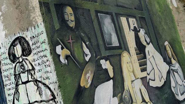 A mural versioning Velazquez' masterpiece ‘Las Meninas’ in Ferrol. The neighbourhood has accumulated around 240 quirky variants of Velazquez’s 17th century painting, which depicts young Infanta Margarita with her ladies-in-waiting (Meninas in Spanish), wearing tight corsets and wide, bouffant skirts. (Miguel Riopa / AFP) A mural versioning Velazquez' masterpiece ‘Las Meninas’ in Ferrol. The neighbourhood has accumulated around 240 quirky variants of Velazquez’s 17th century painting, which depicts young Infanta Margarita with her ladies-in-waiting (Meninas in Spanish), wearing tight corsets and wide, bouffant skirts. (Miguel Riopa / AFP)