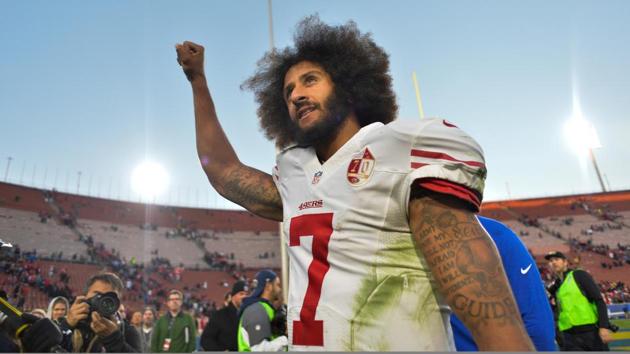 San Francisco 49ers quarterback Colin Kaepernick (centre) kneels during the American national anthem.(Reuters File Photo)
