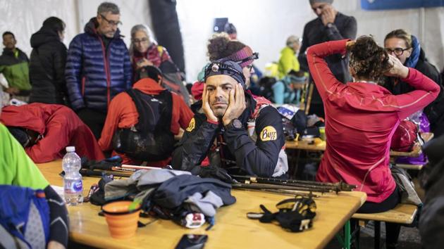 Competitors take some rest in the night at a refreshment post in Trient, Switzerland. This high-altitude race took a pack of about 2,300 runners through three different countries (France, Italy and Switzerland) and across rivers and glaciers. (Laurent Cipriani / AP) Competitors take some rest in the night at a refreshment post in Trient, Switzerland. This high-altitude race took a pack of about 2,300 runners through three different countries (France, Italy and Switzerland) and across rivers and glaciers. (Laurent Cipriani / AP)