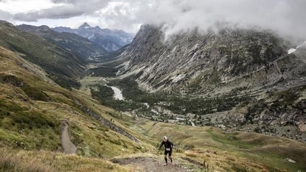 A competitor runs up the Grand Col Ferret as he competes in the UTMB race, near Courmayeur, Italy. The best of the best in the race usually take little over 20 hours in completing the circuit. Most runners finish with a time between 35 and 42 hours, spread over two days. (Laurent Cipriani / AP) A competitor runs up the Grand Col Ferret as he competes in the UTMB race, near Courmayeur, Italy. The best of the best in the race usually take little over 20 hours in completing the circuit. Most runners finish with a time between 35 and 42 hours, spread over two days. (Laurent Cipriani / AP)