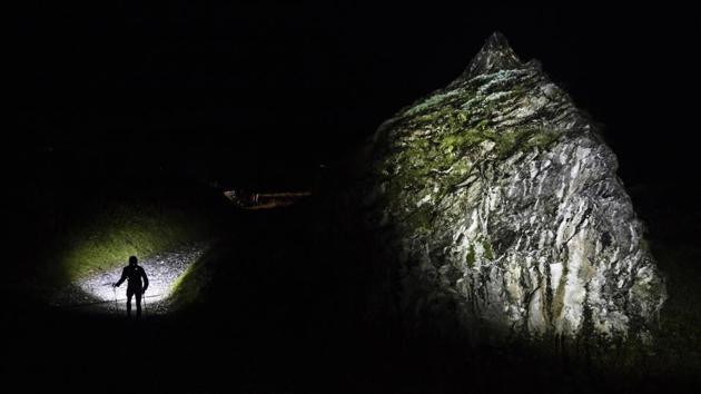 A competitor runs in the night on the Balmes path, in Les Contamines Montjoie, French Alps. Putting up with fatigue, altitude changes greater than the height of Mount Everest and harsh weather conditions, many retire without reaching the finish line. Their names too are added to the list of competitors at the end of the race. (Laurent Cipriani / AP) A competitor runs in the night on the Balmes path, in Les Contamines Montjoie, French Alps. Putting up with fatigue, altitude changes greater than the height of Mount Everest and harsh weather conditions, many retire without reaching the finish line. Their names too are added to the list of competitors at the end of the race. (Laurent Cipriani / AP)