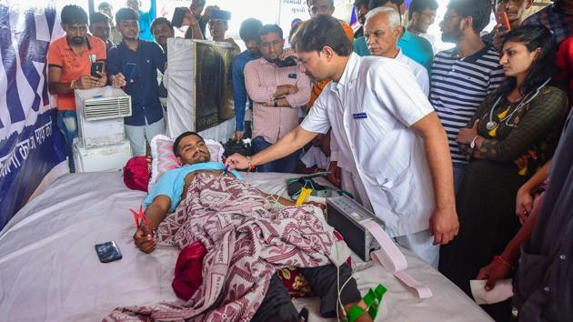 A doctor checks the health of Patidar Anamat Andolan Samiti leader Hardik Patel on the seventh day of his indefinite hunger strike for reservation in Ahmedabad on Friday.(PTI Photo)