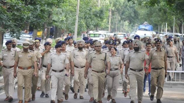Police holding a flag march on the eve of student elections at Panjab University.(HT Photo)