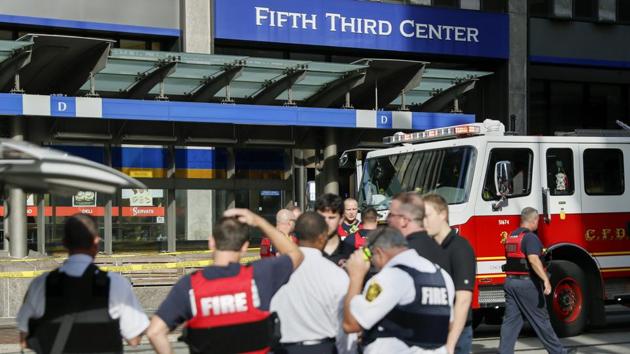 Emergency personnel and police at the crime scene. (AP) Emergency personnel and police at the crime scene. (AP)