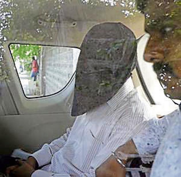 Amol Kale (masked) produced in court in Pune on Thursday. (Rahul Raut/ HT Photo) Amol Kale (masked) produced in court in Pune on Thursday. (Rahul Raut/ HT Photo)