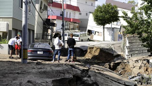 People look at an area damaged by an earthquake in Sapporo in Japan's northern island of Hokkaido, Japan, in this photo taken by Kyodo September 6, 2018. (Kyodo/ Reuters) People look at an area damaged by an earthquake in Sapporo in Japan's northern island of Hokkaido, Japan, in this photo taken by Kyodo September 6, 2018. (Kyodo/ Reuters)