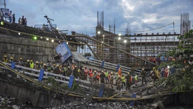 Soon after a portion of the bridge collapsed on Tuesday, Rail Vikas Nigam Limited, which is executing the construction of the Joka-BBD Bag metro corridor, had said that “there is no connection of metro construction” with the incident. (PTI) Soon after a portion of the bridge collapsed on Tuesday, Rail Vikas Nigam Limited, which is executing the construction of the Joka-BBD Bag metro corridor, had said that “there is no connection of metro construction” with the incident. (PTI)