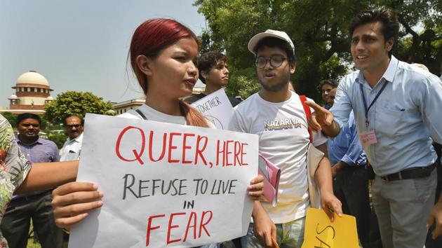 People react after the Supreme Court verdict which decriminalises consensual gay sex, outside the Supreme Court in New Delhi.(PTI Photo)