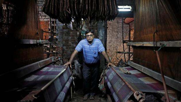 Tilak Raj Bathla, 50, is the owner of a weaving factory. His tiny factory is one of the few still humming. “I have a GST registration, but I can't work as my vendors and buyers are unable to comply with a complex tax structure,” Bathla said, adding his monthly sales had fallen to about 250,000 rupees from about one million rupees before the GST. (Adnan Abidi / REUTERS)