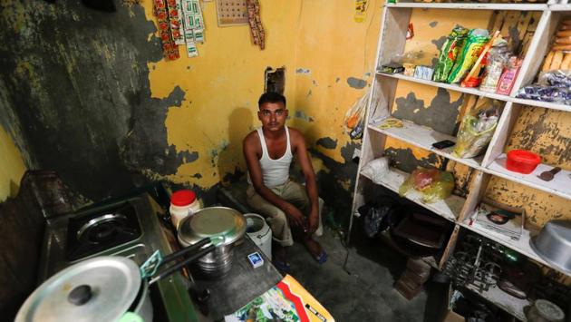 Raj Narayan, who lost his job as a powerloom operator earlier this year, now runs this tea shop in Panipat. "I sent my family back to the village because I am not earning like I used to and it was getting very difficult to support them and bear the expenses," Narayan said. (Adnan Abidi / REUTERS)