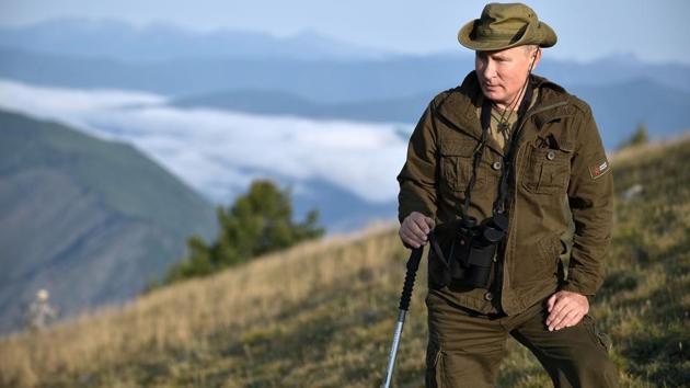 A picture taken on August 26, 2018, shows Russian President Vladimir Putin standing on a mountain during a short vacation in the remote Tuva region in southern Siberia.(AFP File Photo)