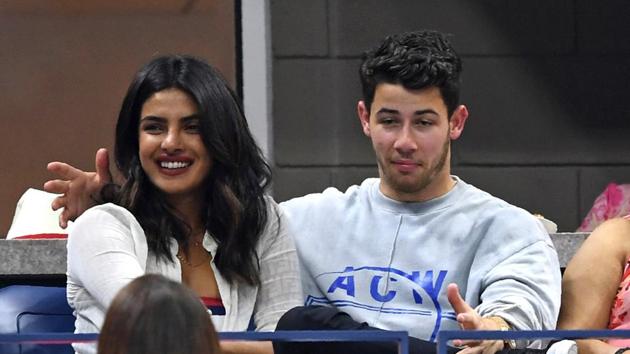 Nick Jonas and Priyanka Chopra have their picture taken by fans as they watched Dominic?Thiem of Austria playing Rafael?Nadal of Spain during their US Open tennis men's singles quarter-finals match September 4.(AFP)