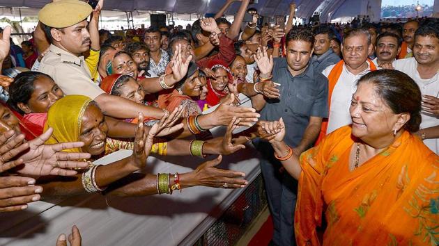 Rajasthan chief minister Vasundhara Raje meets people at a public rally during her Rajasthan Gaurav Yatra at Jaitaran on Wednesday.(PTI photo)