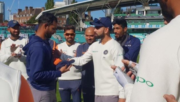 Hanuma Vihari being handed his Test cap by captain Virat Kohli. (BCCI/Twitter) Hanuma Vihari being handed his Test cap by captain Virat Kohli. (BCCI/Twitter)