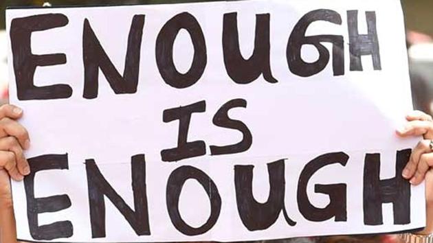 An activist holds a placard at a rally against sexual crimes across India (AFP File) An activist holds a placard at a rally against sexual crimes across India (AFP File)