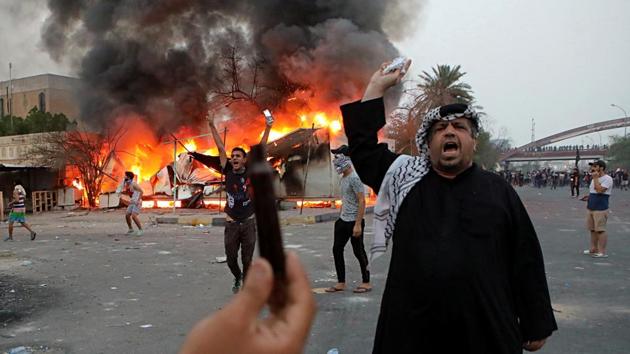 Protesters try to storm and burn the governor’s building during protests demanding better public services and jobs, in Basra, southeast of Baghdad, Iraq. Iraqi security forces fired tear gas and live ammunition on hundreds of protesters. (Nabil al-Jurani / AP) Protesters try to storm and burn the governor’s building during protests demanding better public services and jobs, in Basra, southeast of Baghdad, Iraq. Iraqi security forces fired tear gas and live ammunition on hundreds of protesters. (Nabil al-Jurani / AP)