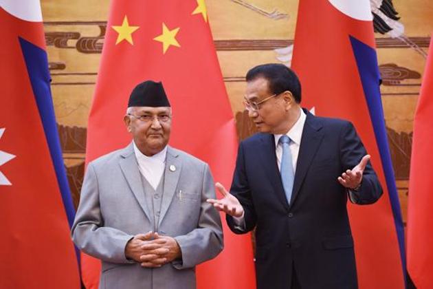 Nepal's Prime Minister KP Sharma Oli (L) chats with Chinese Premier Li Keqiang during a signing ceremony at the Great Hall of the People in Beijing on June 21, 2018.(AFP File Photo)