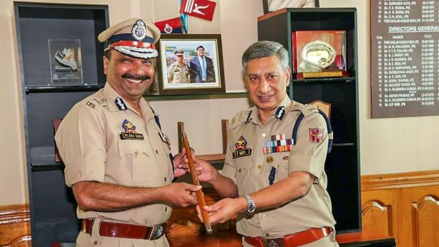 Former Director General of Police SP Vaid passes on the baton as Dilbag Singh takes over as DGP at Police Headquarter, in Srinagar, Friday, Sept 7, 2018. (PTI Photo) Former Director General of Police SP Vaid passes on the baton as Dilbag Singh takes over as DGP at Police Headquarter, in Srinagar, Friday, Sept 7, 2018. (PTI Photo)