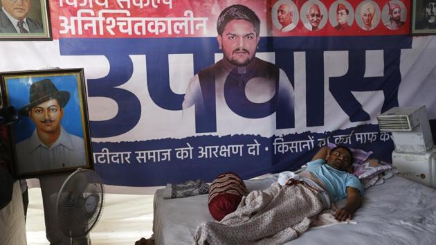 Patidar Anamat Andolan Samiti (PASS) leader Hardik Patel was taken to a hospital after his health deteriorated. He has been on an indefinite hunger strike since August 25, demanding reservations for Patidar community and loan waiver for farmers. (Ajit Solanki / AP File) Patidar Anamat Andolan Samiti (PASS) leader Hardik Patel was taken to a hospital after his health deteriorated. He has been on an indefinite hunger strike since August 25, demanding reservations for Patidar community and loan waiver for farmers. (Ajit Solanki / AP File)