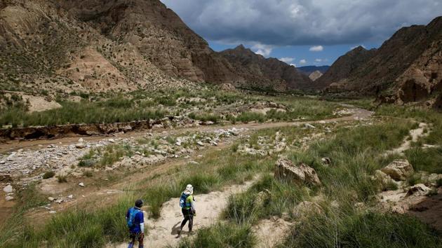 Participants compete during the Super Salmon ultra-marathon near the Longyangxia Reservoir in Qinghai province, China. This sleepy waterfront town of about 3,000 people, has in the last decade poured more than 1.6 billion yuan ($233 million), much of it from private investment, into bike tracks, scenic areas and refurbished hotels in an attempt to lure sporty travellers. (Thomas Peter / REUTERS) Participants compete during the Super Salmon ultra-marathon near the Longyangxia Reservoir in Qinghai province, China. This sleepy waterfront town of about 3,000 people, has in the last decade poured more than 1.6 billion yuan ($233 million), much of it from private investment, into bike tracks, scenic areas and refurbished hotels in an attempt to lure sporty travellers. (Thomas Peter / REUTERS)