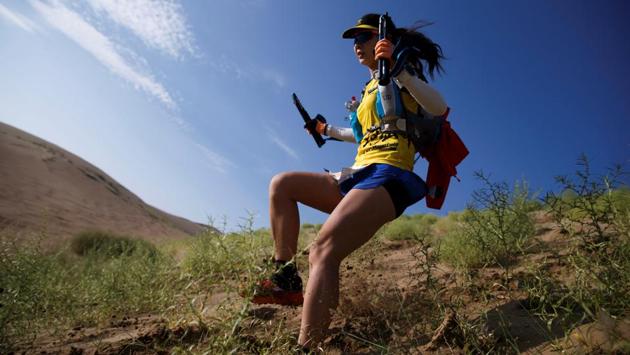When Dou Jianyun, 45, wanted more time for trail running, she took a job in sales at a Beijing-based sportswear startup. One of only three female runners to make it to the finish line for the race, she brought three GPS systems with her and new walking poles to guard against injury on the rocky trails. (Thomas Peter / REUTERS) When Dou Jianyun, 45, wanted more time for trail running, she took a job in sales at a Beijing-based sportswear startup. One of only three female runners to make it to the finish line for the race, she brought three GPS systems with her and new walking poles to guard against injury on the rocky trails. (Thomas Peter / REUTERS)