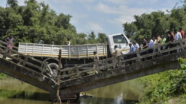 An old bridge collapsed near Siliguri in north Bengal, leaving a truck driver injured, a state minister said. This is the second incident of bridge collapse in the state in three days. The Majerhat Bridge collapsed in South Kolkata on September 4, killing three persons and injuring 24. (Diptendu Dutta / AFP) An old bridge collapsed near Siliguri in north Bengal, leaving a truck driver injured, a state minister said. This is the second incident of bridge collapse in the state in three days. The Majerhat Bridge collapsed in South Kolkata on September 4, killing three persons and injuring 24. (Diptendu Dutta / AFP)