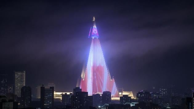 A light show is displayed on the Ryugyong hotel (C) amid the city skyline, seen from the Yanggakdo hotel in Pyongyang. North Korea is preparing to mark the 70th anniversary of its founding. (Ed Jones / AFP) A light show is displayed on the Ryugyong hotel (C) amid the city skyline, seen from the Yanggakdo hotel in Pyongyang. North Korea is preparing to mark the 70th anniversary of its founding. (Ed Jones / AFP)
