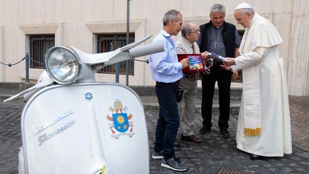 Pope Francis (R) meets members of the Vespa Piaggio association during a meeting at the Vatican City where the Roman Catholic Church leader was donated an original Vespa 50R. (Vatican Handout / AFP) Pope Francis (R) meets members of the Vespa Piaggio association during a meeting at the Vatican City where the Roman Catholic Church leader was donated an original Vespa 50R. (Vatican Handout / AFP)