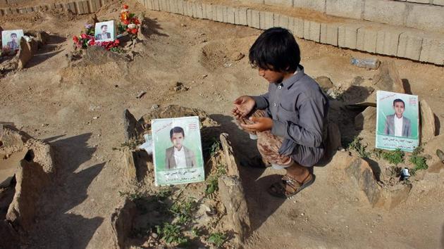 A Yemeni child recites a prayer by the graves of schoolboys who were killed while on a bus that was hit by a Saudi-led coalition air strike on the Dahyan market in August, at a cemetery in the Huthi rebels’ stronghold province of Saada. (AFP) A Yemeni child recites a prayer by the graves of schoolboys who were killed while on a bus that was hit by a Saudi-led coalition air strike on the Dahyan market in August, at a cemetery in the Huthi rebels’ stronghold province of Saada. (AFP)