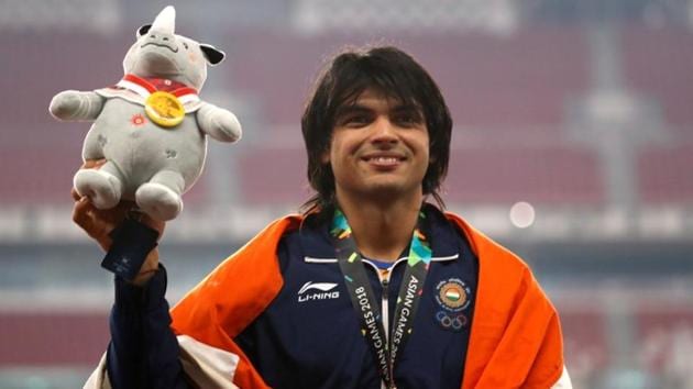 Neeraj Chopra celebrates after winning gold at the Asian Games 2018.(REUTERS)