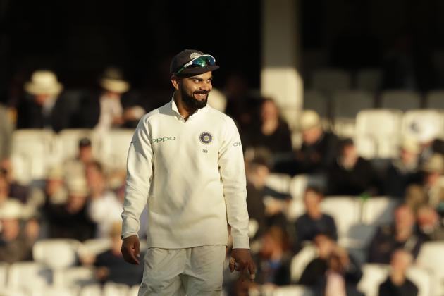 Virat Kohli was all smiles as he lead India out of the ground (AP) 