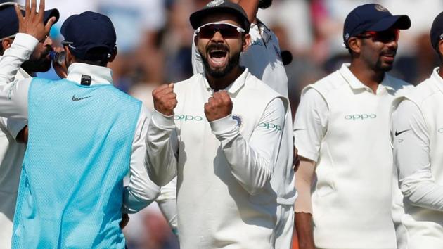 India's Virat Kohli celebrates the wicket of England's Joe Root at The Oval.(REUTERS)