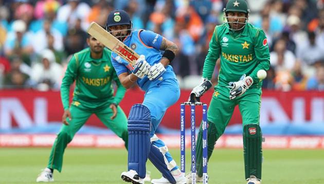 BIRMINGHAM, ENGLAND - JUNE 04: Virat Kohli of India plays to the offside as Pakistan wicketkeeper Sarfraz Ahmed looks on during the ICC Champions Trophy match between India and Pakistan at Edgbaston on June 4, 2017 in Birmingham, England. (Getty Images) BIRMINGHAM, ENGLAND - JUNE 04: Virat Kohli of India plays to the offside as Pakistan wicketkeeper Sarfraz Ahmed looks on during the ICC Champions Trophy match between India and Pakistan at Edgbaston on June 4, 2017 in Birmingham, England. (Getty Images)