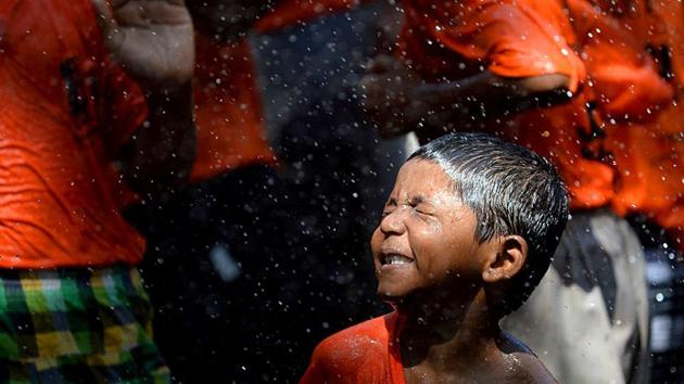 Visually impaired children dance after breaking a 'dahi-handi' during Janmashtami celebration at Victoria School for the blind in Mumbai. (AFP Photo) Visually impaired children dance after breaking a 'dahi-handi' during Janmashtami celebration at Victoria School for the blind in Mumbai. (AFP Photo)