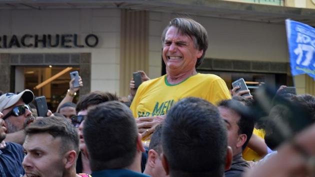 Brazilian right-wing presidential candidate Jair Bolsonaro gestures after being stabbed in the stomach during a campaign rally in Juiz de Fora, Minas Gerais state, in southern Brazil, on September 6, 2018. (AFP Photo) Brazilian right-wing presidential candidate Jair Bolsonaro gestures after being stabbed in the stomach during a campaign rally in Juiz de Fora, Minas Gerais state, in southern Brazil, on September 6, 2018. (AFP Photo)