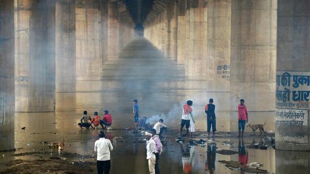 People cremate a body near the flooded Ganga under Shastri bridge at Daraganj ghat, in Allahabad, Uttar Pradesh as water levels of the Ganga and Yamuna rivers increase following monsoon rains. (Sanjay Kanojia / AFP) People cremate a body near the flooded Ganga under Shastri bridge at Daraganj ghat, in Allahabad, Uttar Pradesh as water levels of the Ganga and Yamuna rivers increase following monsoon rains. (Sanjay Kanojia / AFP)