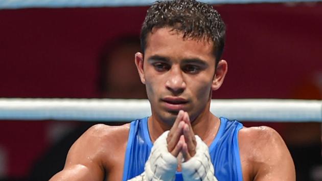 Jakarta: India's Amit Panghal gestures after he was declared winner against Paalam Carlo (unseen) of Philippines in the Men's Light Fly (46-49kg) boxing semifinal bout at the 18th Asian Games 2018 in Jakarta, Indonesia on Friday, Aug 31, 2018.(PTI)