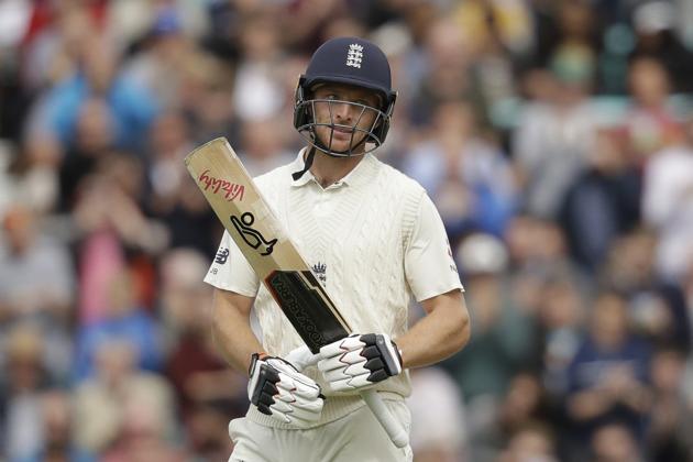 Jos Buttler celebrates after reaching 50 runs during the second day of the fifth test match between England and India at the Oval cricket ground. (AP)