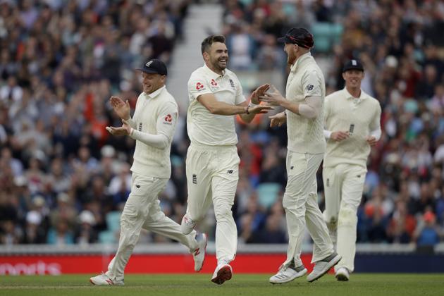 England's Jimmy Anderson, second left, celebrates with his teammates during the second day of the fifth test match between England and India at the Oval cricket ground (AP)