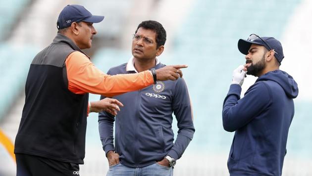 India coach Ravi Shastri (left) speaks with selector Devang Gnadhi and skipper Virat Kohli. (AP) India coach Ravi Shastri (left) speaks with selector Devang Gnadhi and skipper Virat Kohli. (AP)