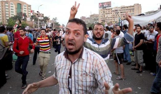 Supporters of Egypt's ousted president Mohammed Morsi gather outside a field hospital following clashes with security forces at Nasr City, where pro-Morsi protesters held a weeks-long sit-in in Cairo, Egypt on July 27, 2013. (AP Photo) Supporters of Egypt's ousted president Mohammed Morsi gather outside a field hospital following clashes with security forces at Nasr City, where pro-Morsi protesters held a weeks-long sit-in in Cairo, Egypt on July 27, 2013. (AP Photo)