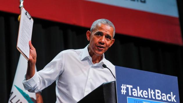 Former US president Barack Obama holds up a clipboard as he participates in a political rally for California Democratic candidates during a event in Anaheim, California. (Reuters Photo) Former US president Barack Obama holds up a clipboard as he participates in a political rally for California Democratic candidates during a event in Anaheim, California. (Reuters Photo)
