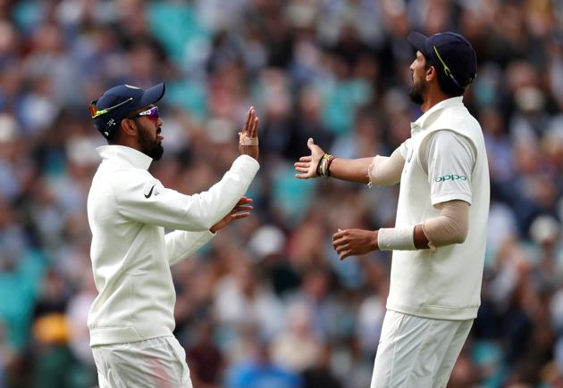 Lokesh Rahul celebrates with Ishant Sharma after England were dismissed during the second day of the fifth test match between England and India at the Oval cricket ground. (REUTERS)