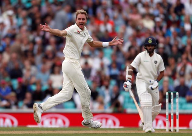 Stuart Broad celebrates the wicket of Shikhar Dhawan during the second day of the fifth test match between England and India at the Oval cricket ground. (REUTERS)