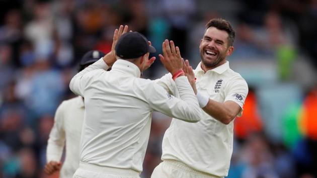 England's James Anderson (R) celebrates the wicket of India's Ajinkya Rahane with Joe Root (REUTERS)