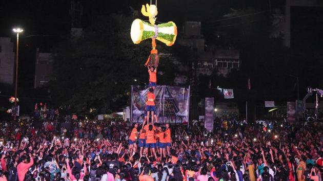 With music played on loudspeakers and dhol tasha raising the pitch of celebrations in Pune, large number of people, including children, joined the excitement to catch a glimpse of the human pyramids as a part of Krishna Janmashtami celebrations. (SANKET WANKHADE/HT PHOTO) With music played on loudspeakers and dhol tasha raising the pitch of celebrations in Pune, large number of people, including children, joined the excitement to catch a glimpse of the human pyramids as a part of Krishna Janmashtami celebrations. (SANKET WANKHADE/HT PHOTO)