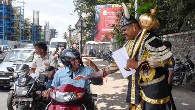 As part of road safety measures, representatives of the Maharashtra metro rail corporation (Maha-Metro), dressed as Yamraj, the Hindu god of death, were present at Deccan corner on Thursday, to raise awareness about the benefits of wearing helmets and safe driving. (SANKET WANKHADE/HT PHOTO) As part of road safety measures, representatives of the Maharashtra metro rail corporation (Maha-Metro), dressed as Yamraj, the Hindu god of death, were present at Deccan corner on Thursday, to raise awareness about the benefits of wearing helmets and safe driving. (SANKET WANKHADE/HT PHOTO)