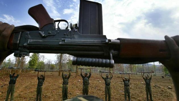 Maoist rebels or Naxalites, raise their arms during an exercise at a temporary base in the Abujh Marh forests in Chhattisgarh. (AP Photo/Mustafa Quraishi) Maoist rebels or Naxalites, raise their arms during an exercise at a temporary base in the Abujh Marh forests in Chhattisgarh. (AP Photo/Mustafa Quraishi)
